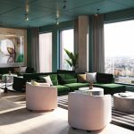 Modern lounge area with green seating and large windows offering city views, part of the studio apartment at 50 Holland Street, G2 4BD, available for rent.